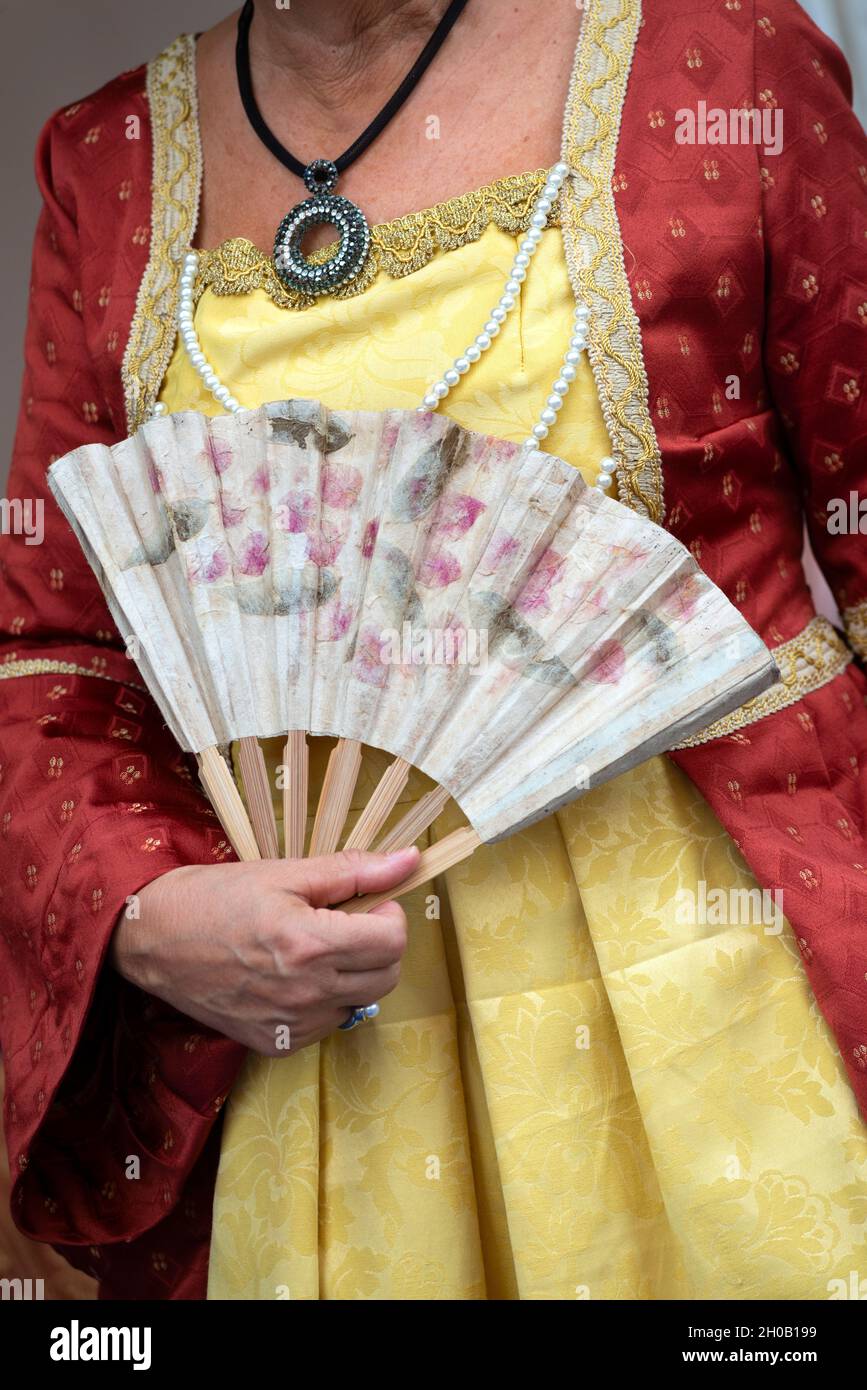 Italy, Lombardy, Historical Recalling, Woman Holding Folding Fans Stock Photo