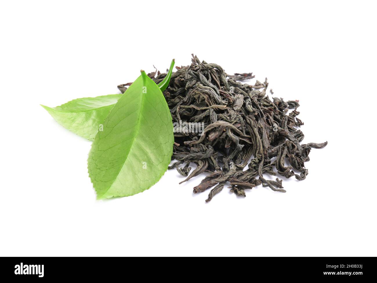 Dry and fresh tea leaves on white background Stock Photo - Alamy