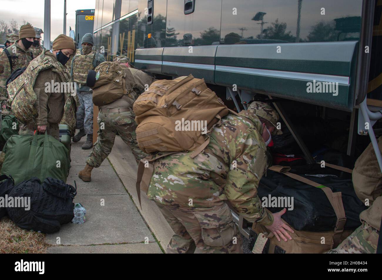 Airmen load their buses with cargo in the overnight parking area of the 166th Airlift Wing, Jan. 15, 2021. Delaware Air National Guard Airmen volunteered to support the 59th Presidential Inauguration. Stock Photo