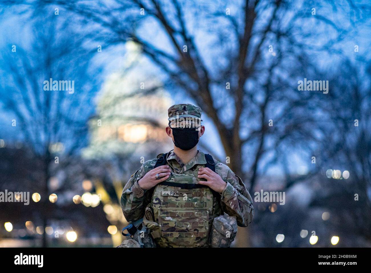 U.S. Army 1st Lt. Joshua Pike, with the 2nd Battalion, 103rd Cavalry Regiment, Virginia National Guard, stands at a security post near the Capitol in Washington, D.C., Jan. 16, 2021. National Guard Soldiers and Airmen from several states have traveled to Washington to provide support to federal and district authorities leading up to the 59th Presidential Inauguration. Stock Photo