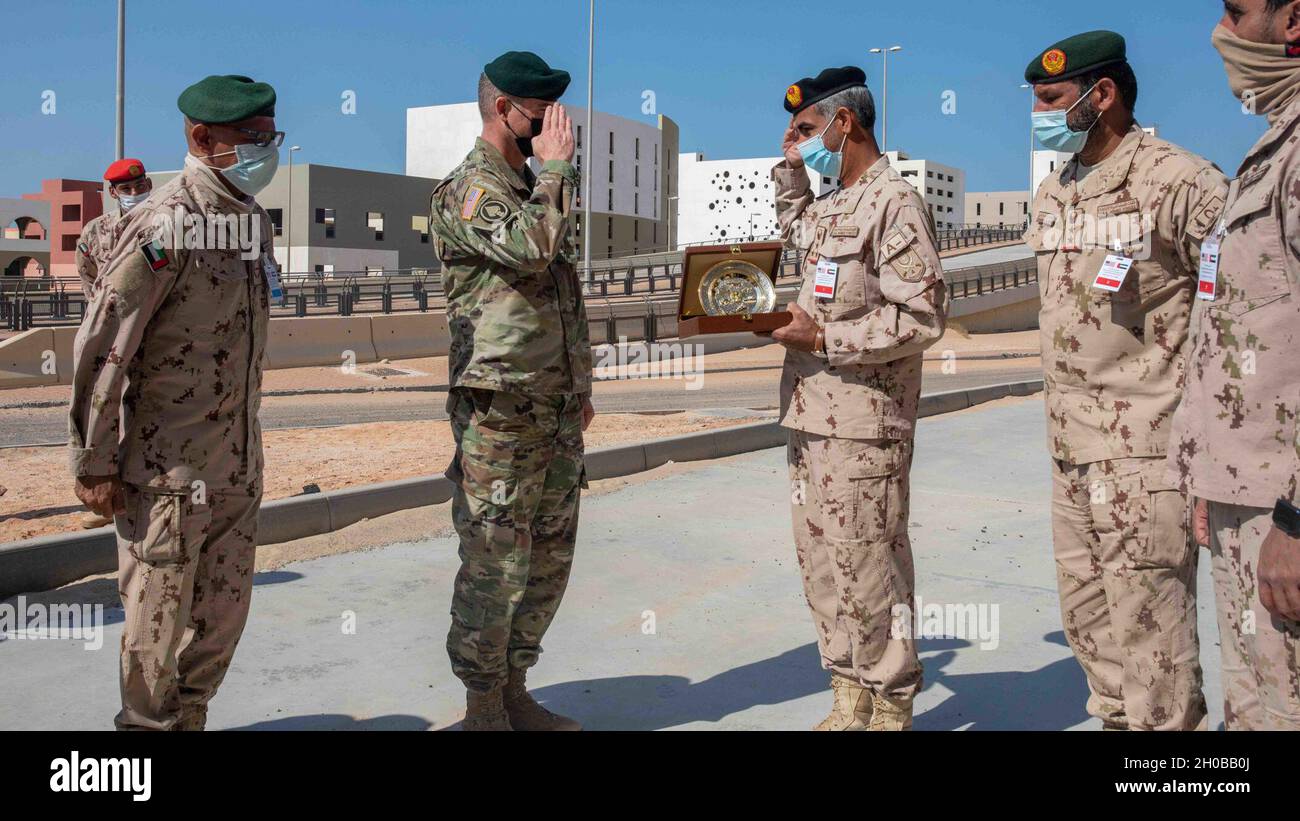 A United Arab Emirate General Officer and U.S. Army General Brig. Gen. Keith Phillips, the Senior Defense Official and Defense Attaché to the United States Embassy Abu Dhabi, United Arab Emirates, exchange gifts during a key leader engagement in the UAE, Jan. 16, 2021. The engagement reinforced UAE and U.S. military cooperation and strengthens regional partnerships. Stock Photo