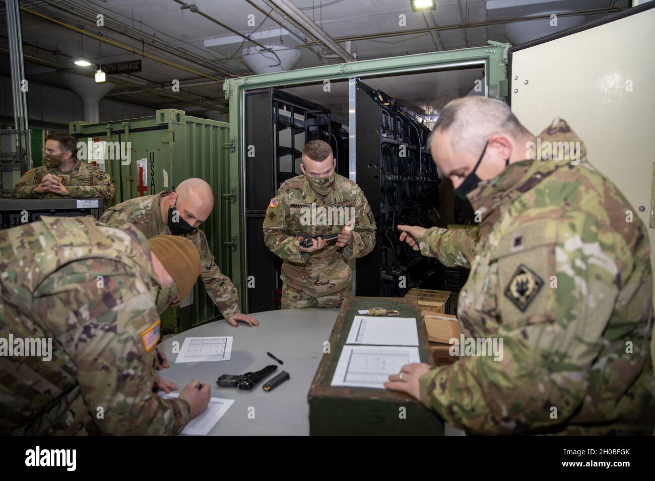 Soldiers of the 114th Military Police Company, Mississippi Army National Guard, issue their M9