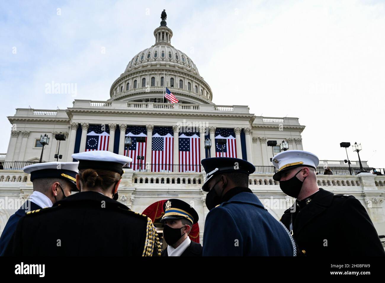 Members from each service brances discuss their roles during rehersal for the 59th Presidential Inauguration in Washington, D.C., Jan. 18 2021. More than 5,000 military members from across all branches of the armed forces of the United States, including reserve and National Guard components, provided ceremonial support and Defense Support of Civil Authorities during the inaugural period.. Stock Photo