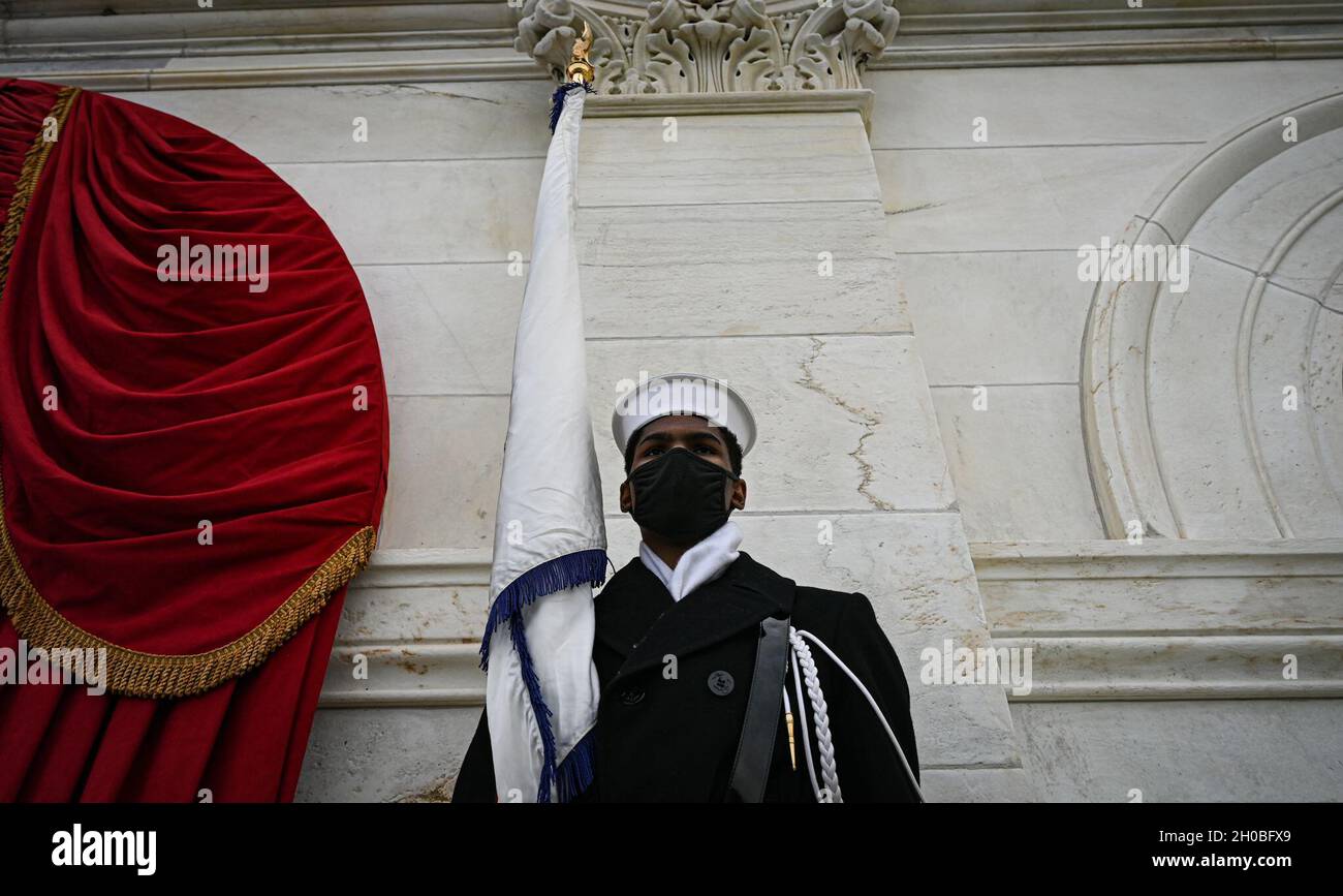 A U.S. Navy ceremonial guardsman stands in position during a rehearsal