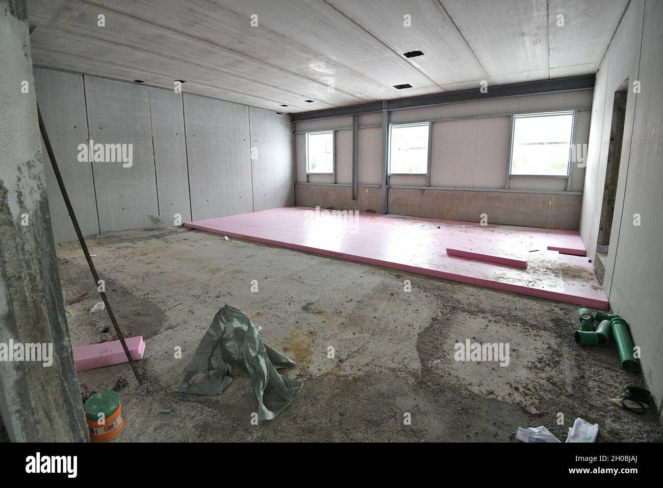 The photo shows the construction site for the future Training Support