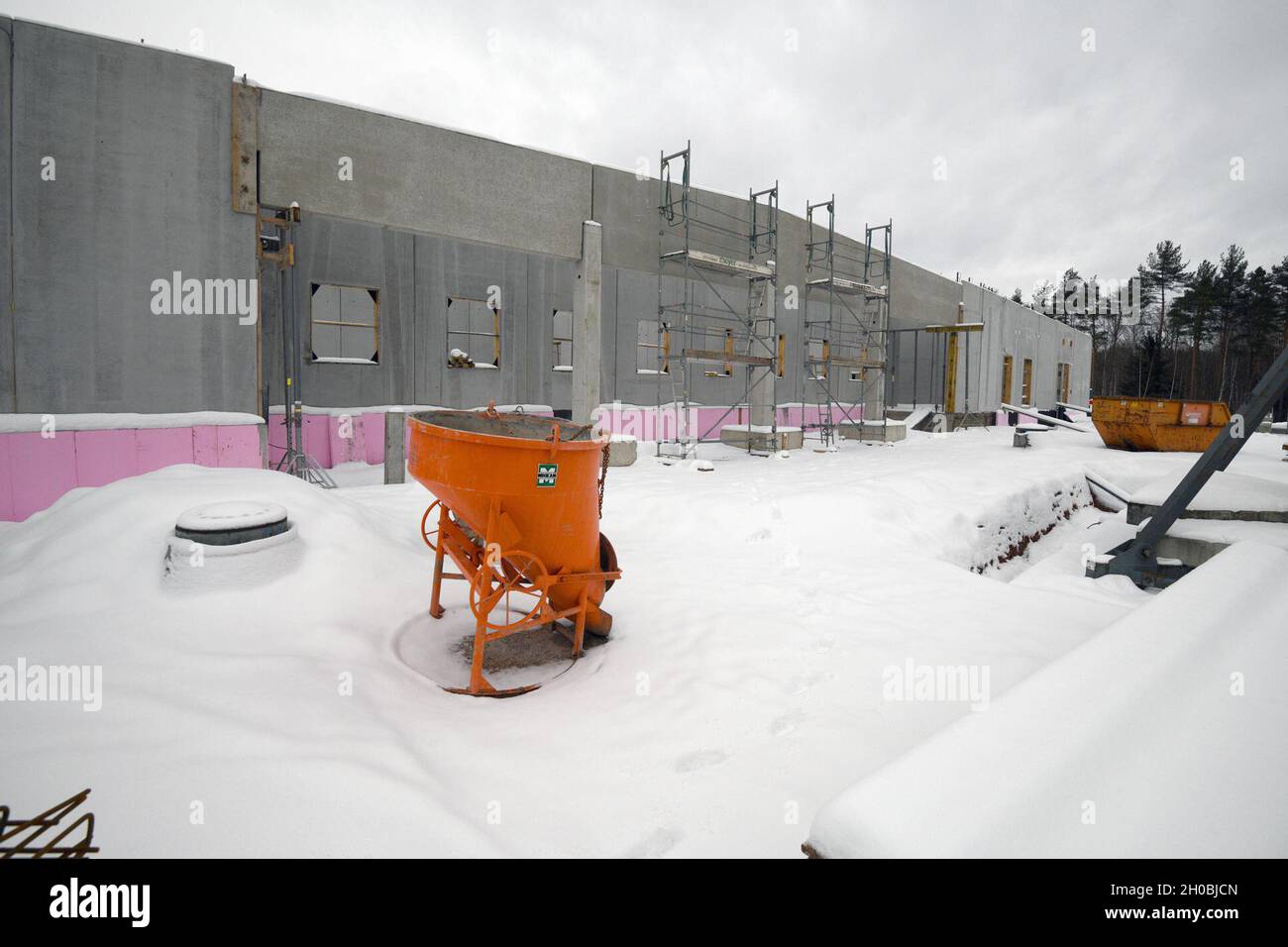 The photo shows the construction site for the future Training Support
