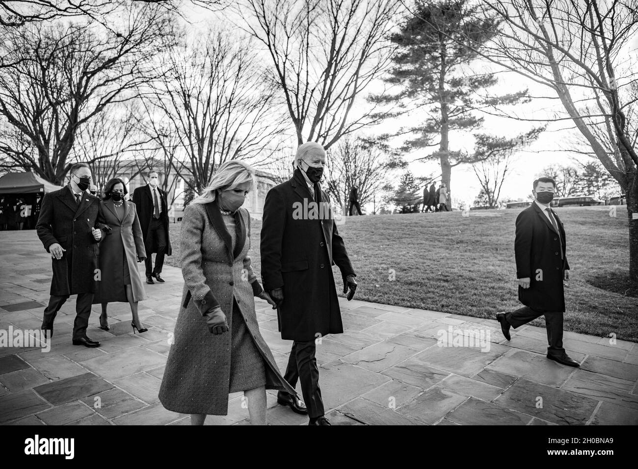 President Joseph R. Biden, Jr., First Lady Dr. Jill Biden, Vice President Kamala Harris, and Second Gentlemen Douglas Emhoff depart Arlington National Cemetery, January 20, 2020. Biden and Harris participated in a Presidential Armed Forces Full Honors Wreath-Laying Ceremony at the Tomb of the Unknown Soldier at Arlington National Cemetery. In attendance were former Presidents Barack H. Obama, George W. Bush, William J. Clinton, and former First Ladies Michelle Obama, Laura Bush, and former Secretary of State Hillary Clinton. The ceremony was hosted by U.S. Army Maj. Gen. Omar Jones IV, command Stock Photo