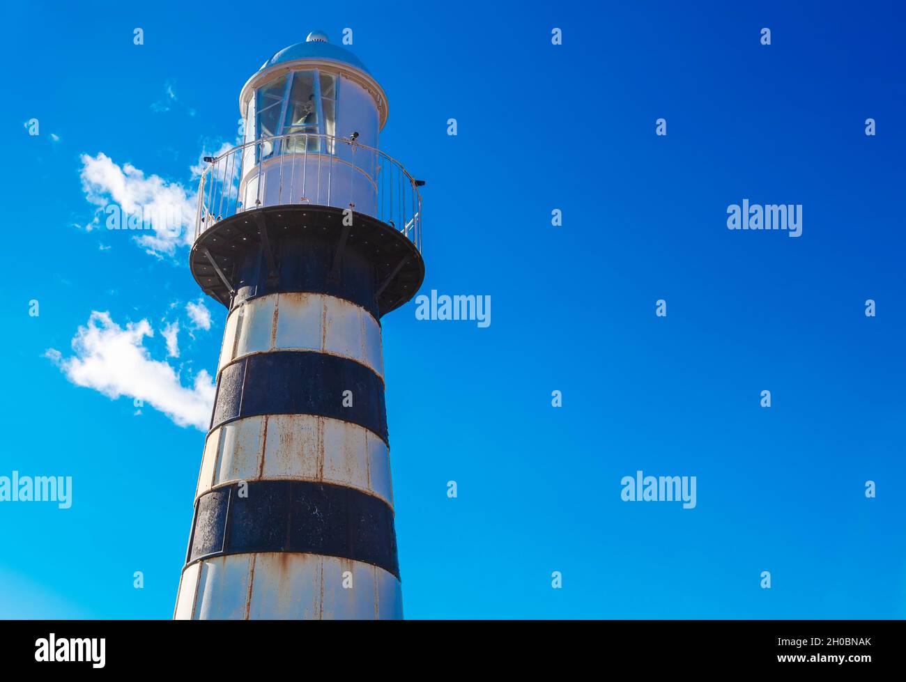 Lighthouse in Kamchatka Peninsula is located on Mayachny Cape on shore of picturesque Avacha Gulf in the Pacific Ocean Stock Photo
