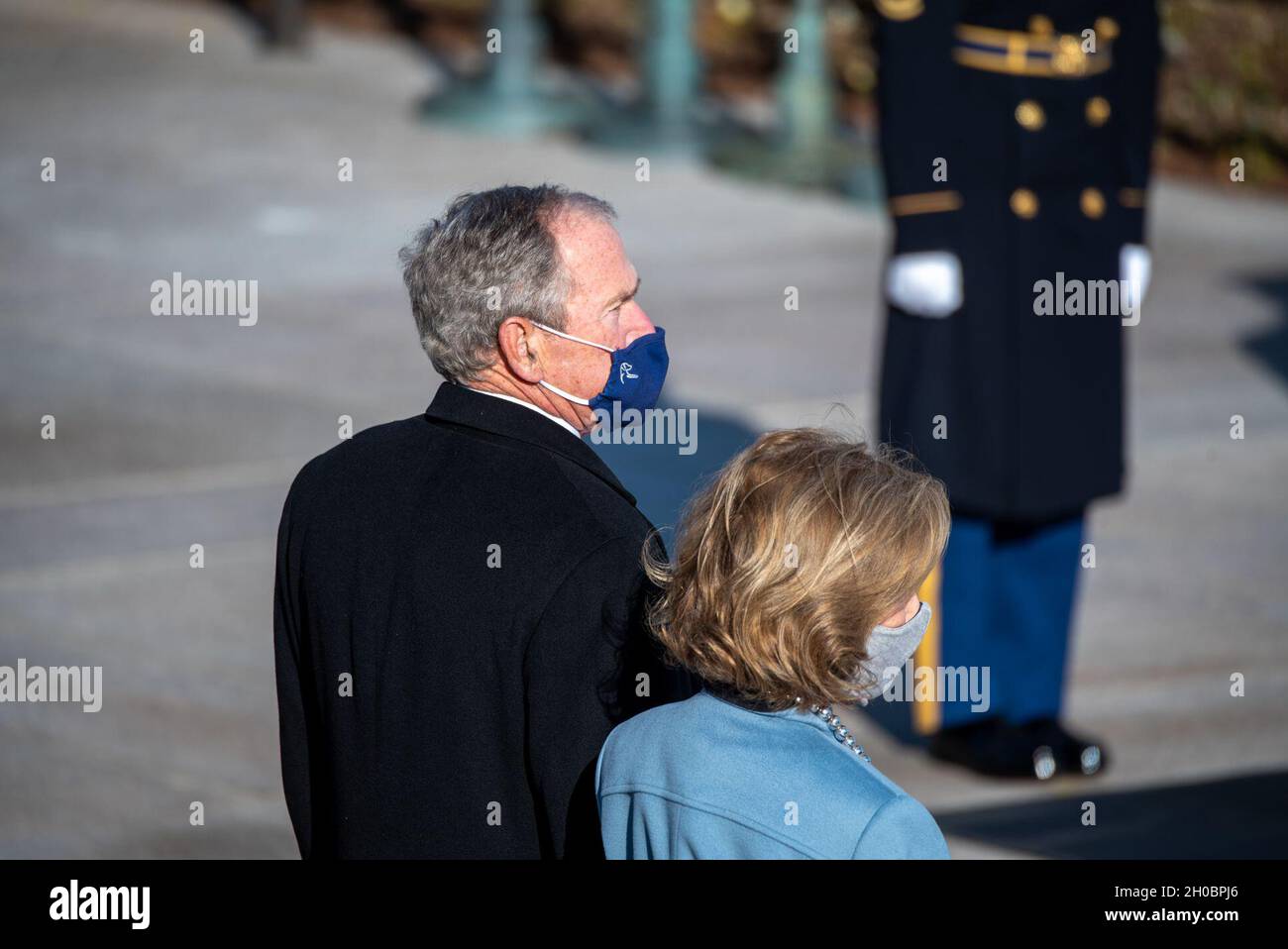 Former president George W. Bush stands with his wife, Laura Bush, prior to a Presidential Armed Forces Wreath Ceremony at the Tomb of the Unknown Soldier in Arlington National Cemetery, Arlington, Virginia, Jan. 20, 2021. During the ceremony, President Joseph R. Biden Jr. and Vice President Kamala Harris honored the fallen with a wreath-laying following the 59th Presidential Inauguration. Stock Photo