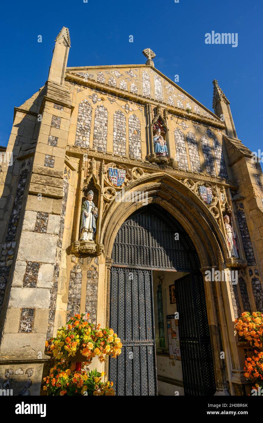 Pinnacled front entrance and richly decorated facade of St Nicholas Parish Church in North Walsham, Norfolk, England. Stock Photo