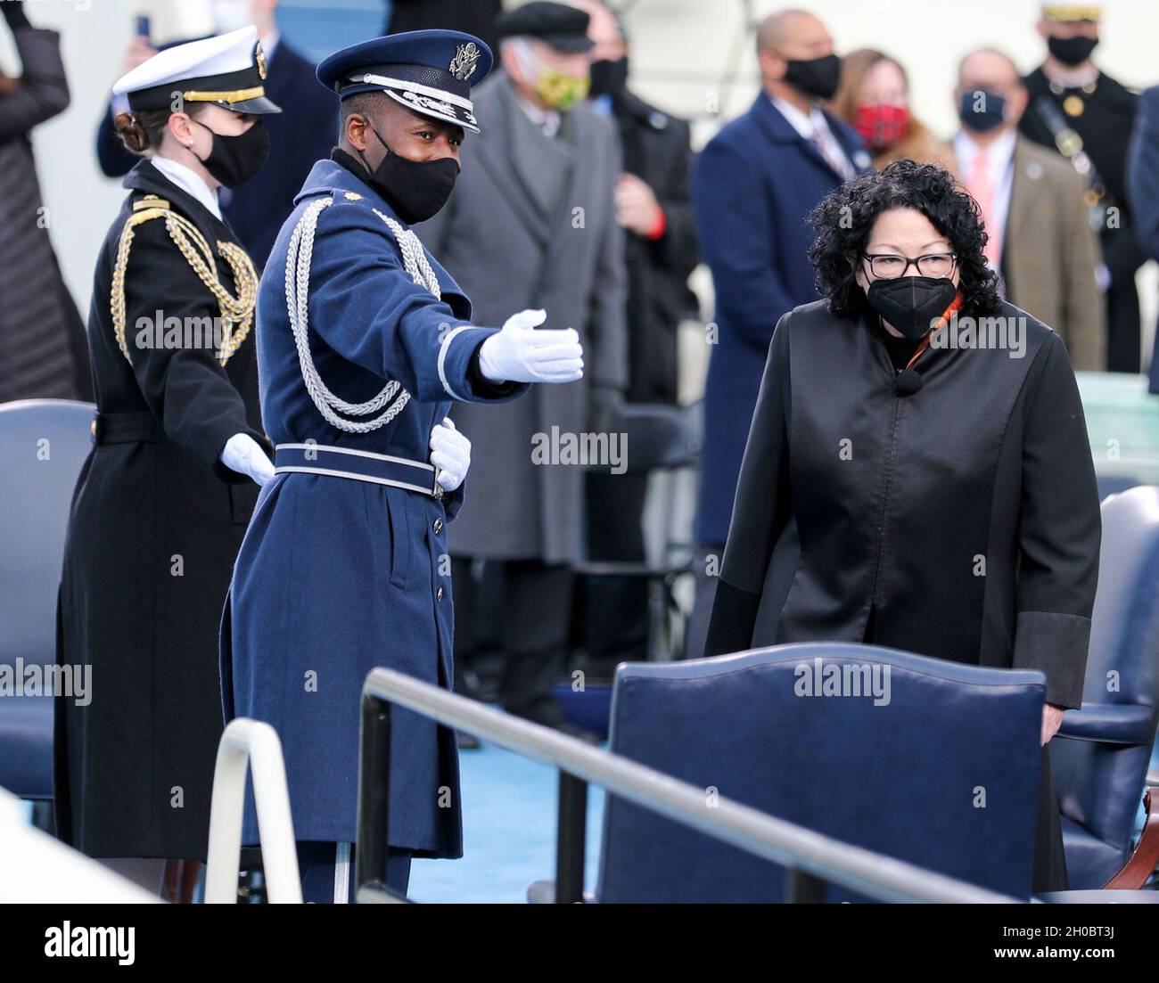 Chief Justice Sonia M. Sotomayor is escorted to her seat by military personnel at the 59th Presidential Inauguration at the U.S. Capitol in Washington, D.C., Jan. 20, 2021. Sotomayor is the first Hispanic and Latina member of the Supreme Court and will be giving the Vice Presidential Oath of Office to Vice President-elect Kamala D. Harris. Stock Photo