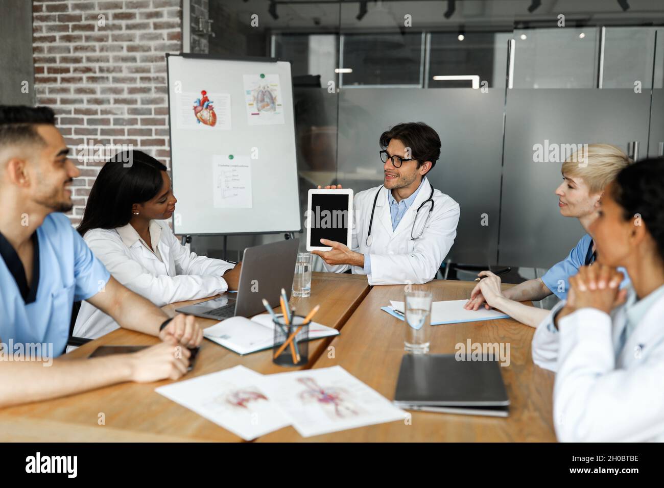 Chief physician holding digital tablet with blank screen Stock Photo