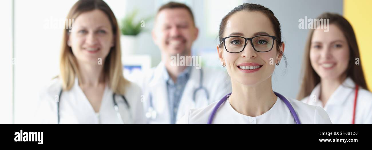 Portrait of medical team standing with clipboard in hospital Stock ...