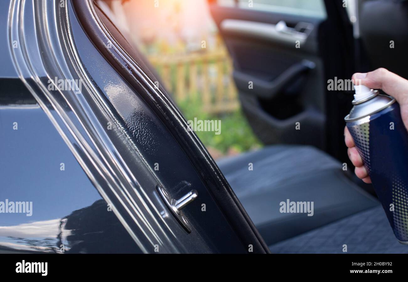 Silicone grease lubrication of rubber door seals in a passenger car,  close-up, design Stock Photo - Alamy