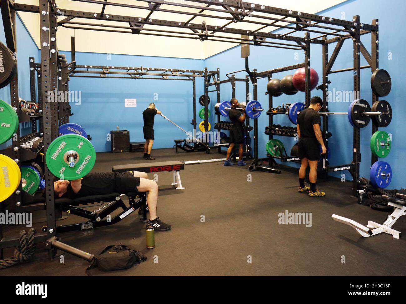 Soldiers work out in the new functional fitness area of the Yano