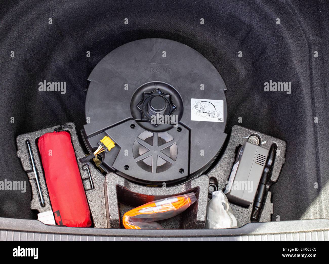 original subwoofer, first aid kit and compressor for inflating wheels in a  car trunk niche, equipment Stock Photo - Alamy