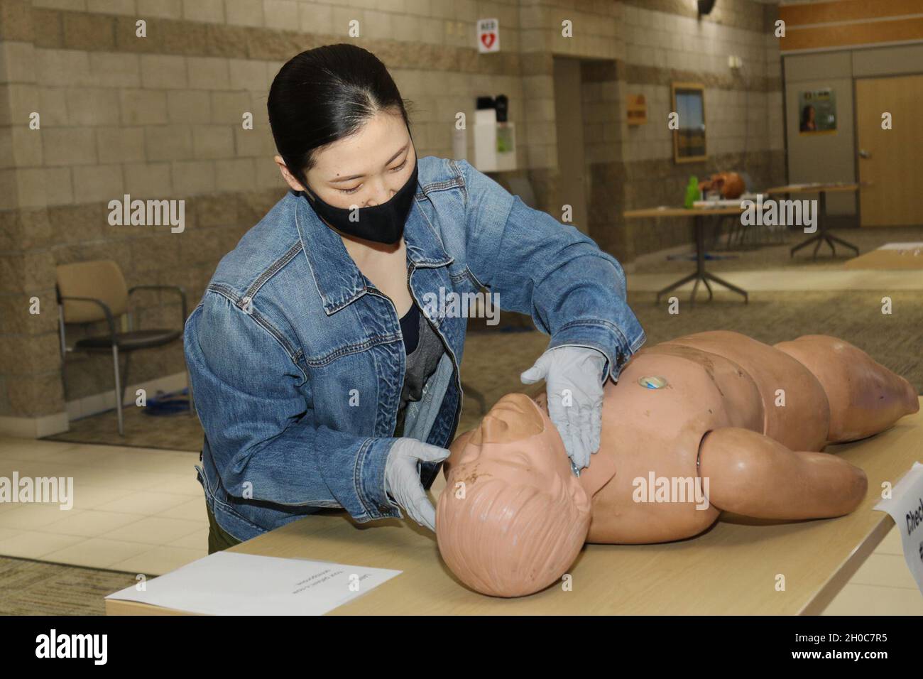 Sgt. Maureen Kang, a licensed practical nurse with Weed Army Community Hospital’s Medical Surgical Ward triages a simulated casualty during the team competition portion of the hospital’s skills fair January 21 at the Mary E. Walker Center at Fort Irwin, Calif. Kang, a Los Angeles native, was among the first hospital staff members to complete the skills fair. Stock Photo