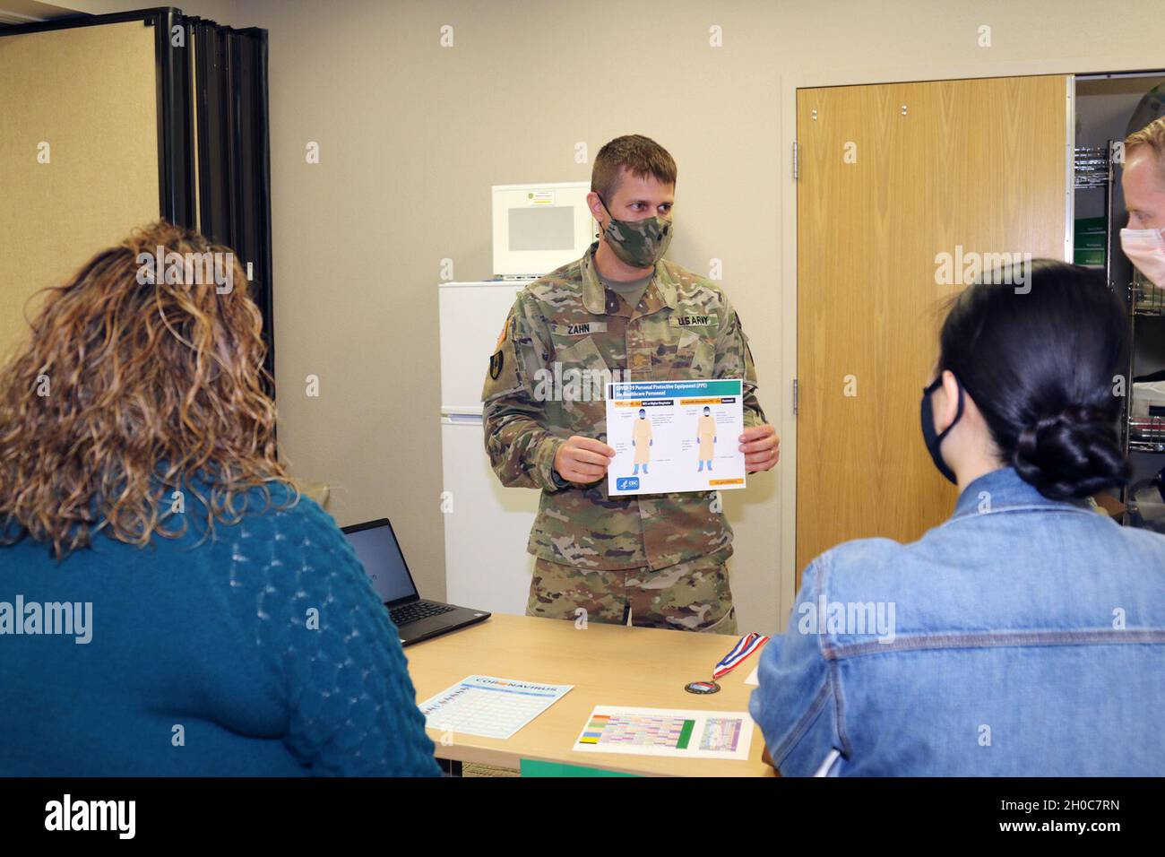 Maj. Kyle Zahn (center), the clinical nurse officer-in-charge of the Weed Army Community Hospital Medical Surgical Ward and Post-Anesthesia Care Unit (PACU), goes over COVID-19 protocols with participants of the hospital’s skills fair January 21 at the Mary E. Walker Center at Fort Irwin, Calif. Weed ACH staff focused several stations of the event on COVID-19 protocol and procedures. Stock Photo