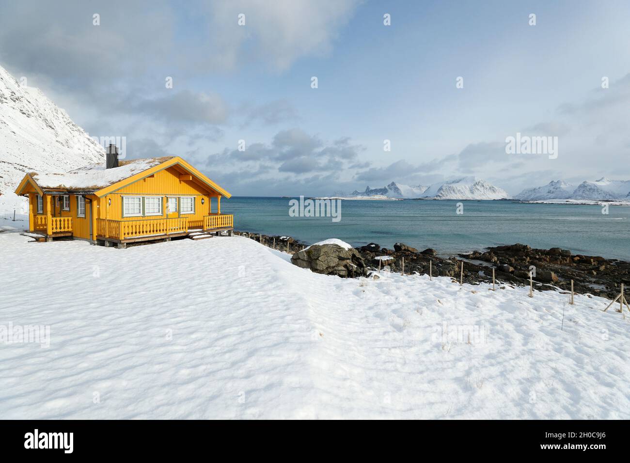 Traditional house on the Ytresand coast in winter, Lofoten, Norway