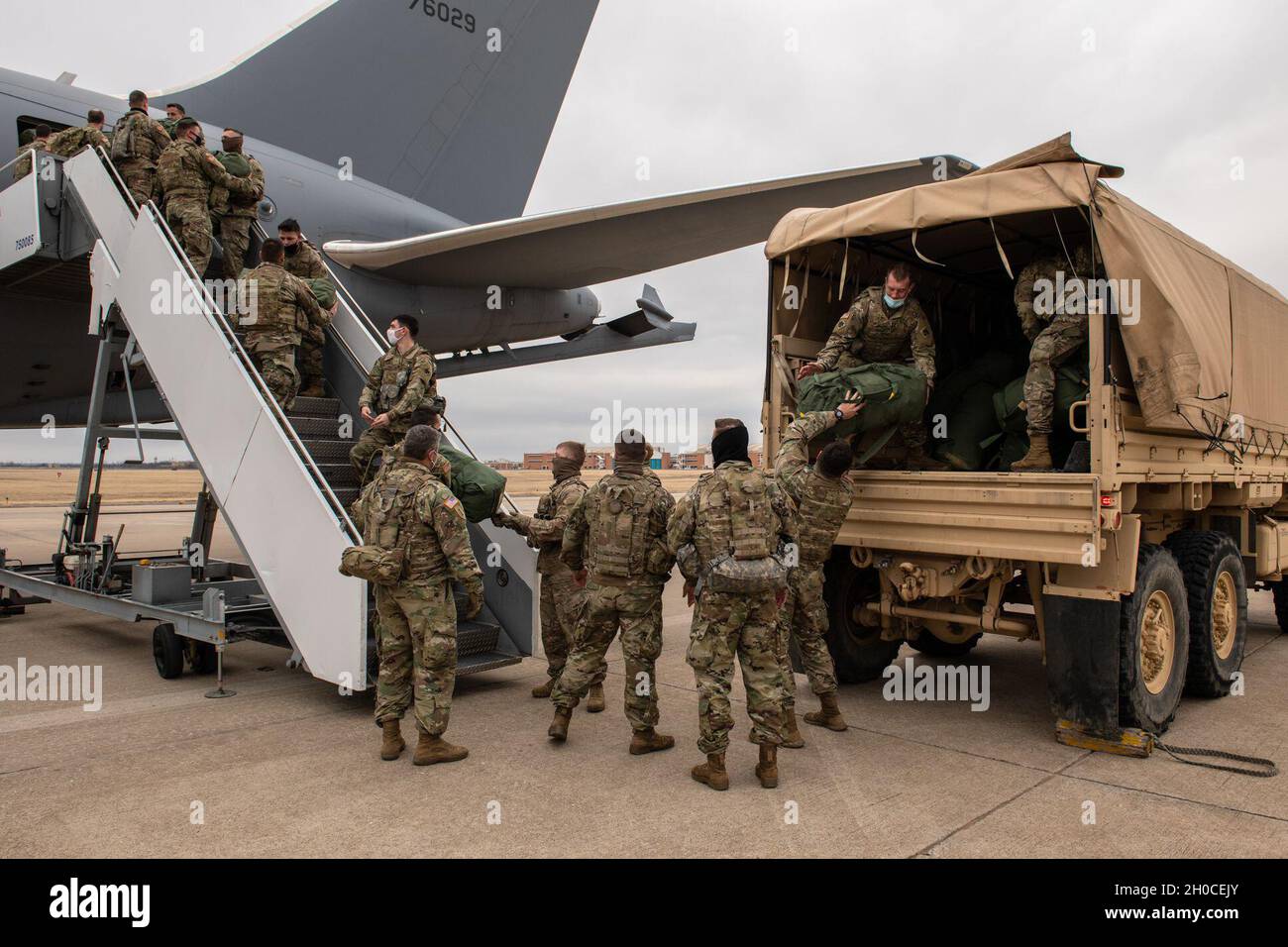 oklahoma-national-guardsmen-unload-their-luggage-from-a-157th-air