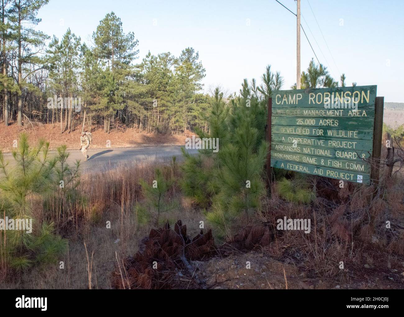 Sgt. 1st Class Marlon Smith reaches the hill crest on Cato Road in the