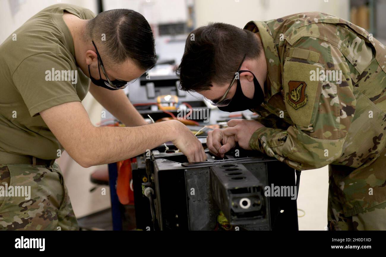 Airmen from the 18th Component Maintenance Squadron repair an ejection ...
