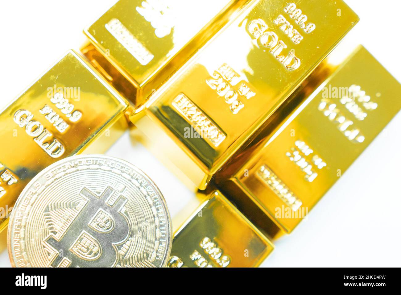 Bitcoin gold coin with golden bars. Cryptocurrency concept. Virtual  currency. Bitcoin as desirable as gold concept Stock Photo - Alamy