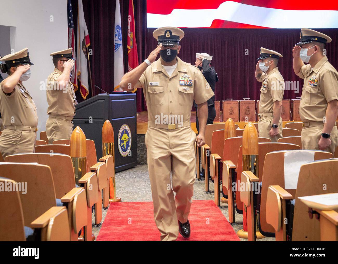 210129-N-DA693-1057  SAN DIEGO (Jan. 29, 2021) Chief Hospital Corpsman Anthony Killings salutes after being pinned to the rank of chief petty officer during a ceremony on board Navy Medicine & Readiness Training Center San Diego (NMRTC) Jan. 29. Due to the COVID-19 pandemic, the ceremony was livestreamed via video teleconference (VTC) and Facebook Live allowing family, friends and staff to participate while adhering to social distancing guidelines set forth from the Centers for Disease Control (CDC). The COVID-19 pandemic has changed the ways of how to conduct business and NMRTC has adapted so Stock Photo