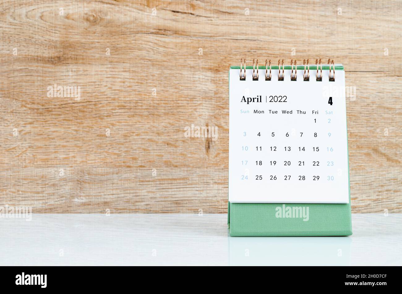 April calendar 2022 on wooden background Stock Photo - Alamy