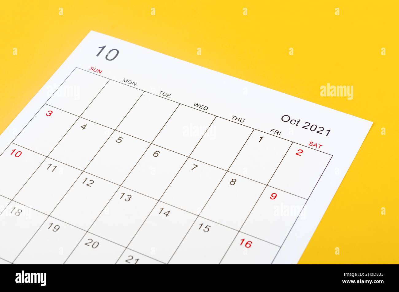 Close up October 2012 calendar sheet on yellow background Stock Photo ...