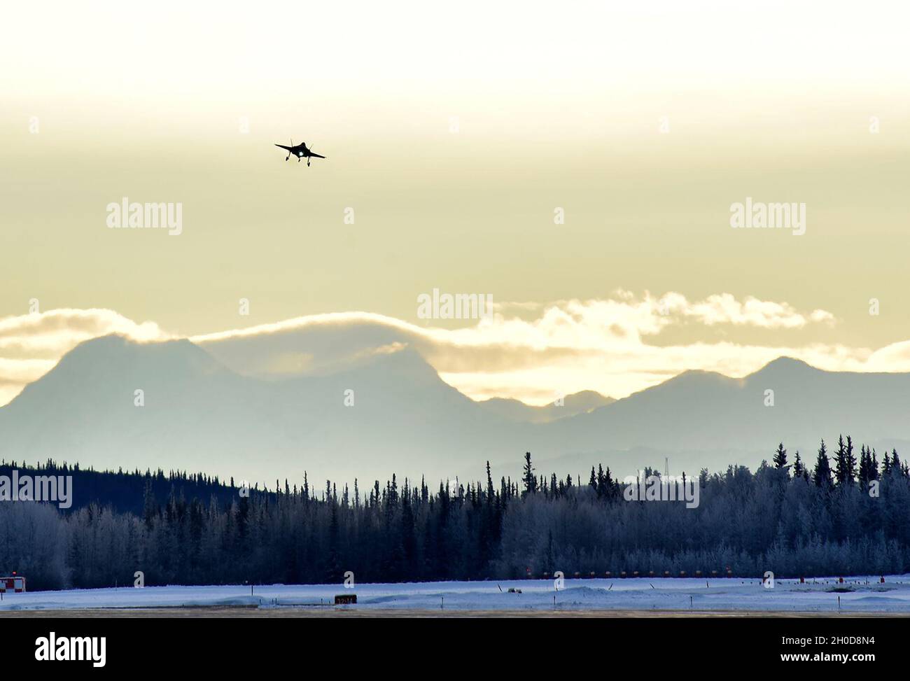 An F-35A Lightning II flys over Eielson Air Force Base, Alaska, Jan. 29, 2021 preparing to land. By the end of 2021 Alaska will have the highest concentration of combat-coded 5th generation aircraft with 54 F-35As total. Stock Photo