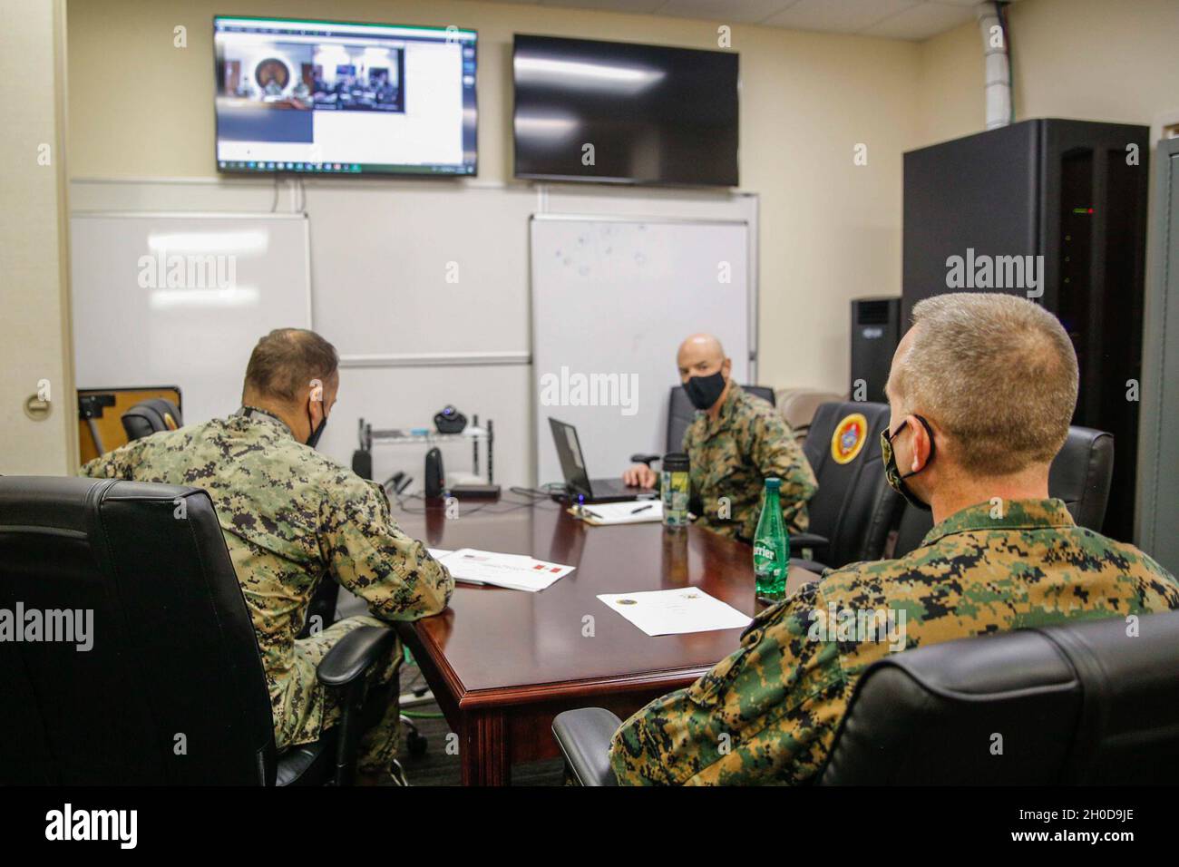 U.S. Marines with U.S. Marine Corps Forces, South, participate in a staff planners working group virtual meeting with members from two elements of the Peruvian armed forces at U.S. Southern Command in Miami, Florida, Jan. 29, 2021. The staff planners working group consisted of planners from U.S. Marine Corps Forces, South, and U.S. Naval Forces Southern Command/U.S. 4th Fleet, the Peruvian Navy’s Pacific Operations Command, Peruvian Marines from the Marine Amphibious Brigade and the Navy section chief of the Security Cooperation Office at the U.S. Embassy in Lima, Peru. The purpose of the staf Stock Photo