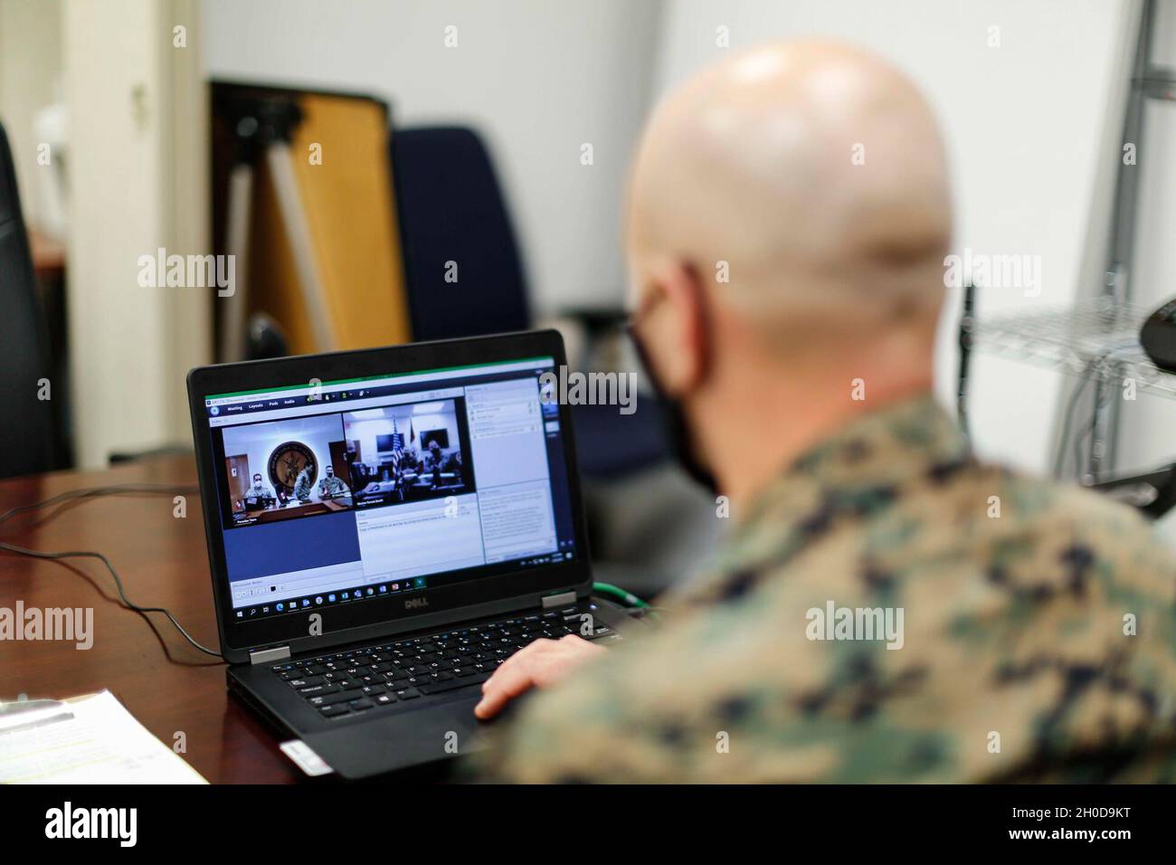 U.S. Marine Maj. Landry Guillory, a foreign area officer with U.S. Marine Corps Forces, South, speaks with members from Peruvian armed forces during a staff planners working group virtual meeting at U.S. Southern Command in Miami, Florida, Jan. 29, 2021. The staff planners working group consisted of planners from U.S. Marine Corps Forces, South, and U.S. Naval Forces Southern Command/U.S. 4th Fleet, the Peruvian Navy’s Pacific Operations Command, Peruvian Marines from the Marine Amphibious Brigade and the Navy section chief of the Security Cooperation Office at the U.S. Embassy in Lima, Peru. Stock Photo