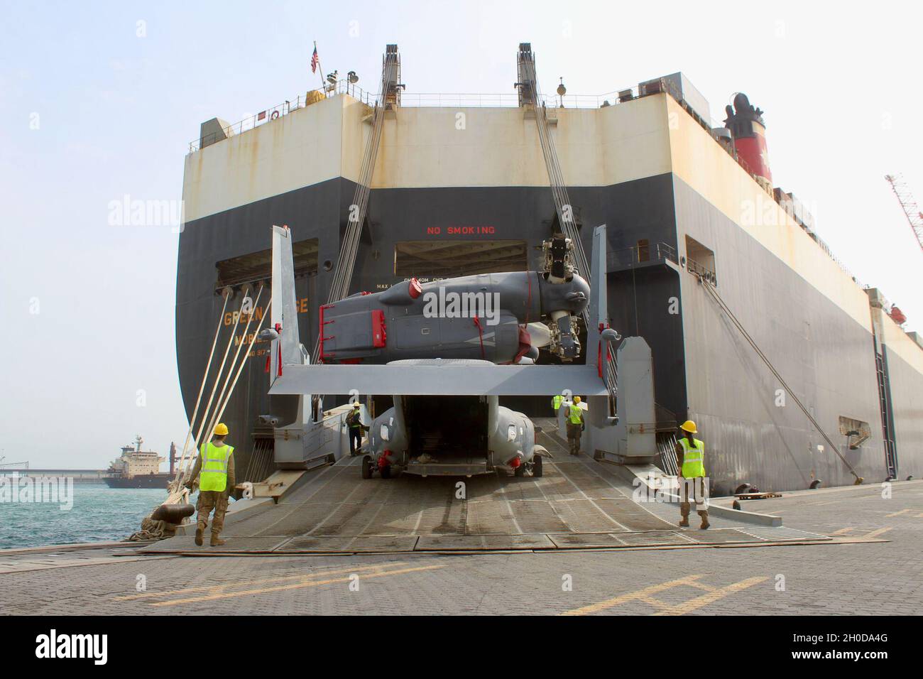 Osprey Rear Ramp Air Force mechanics guide the movement of a CV-22 Osprey through the ...