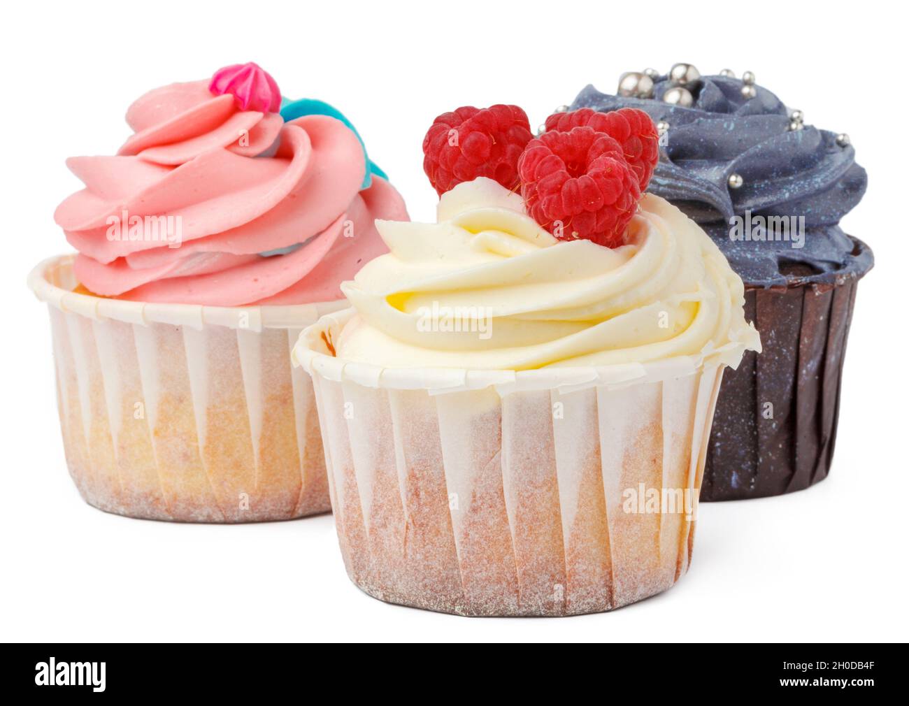 Three Cupcakes Close Up Isolated On White Background Stock Photo Alamy