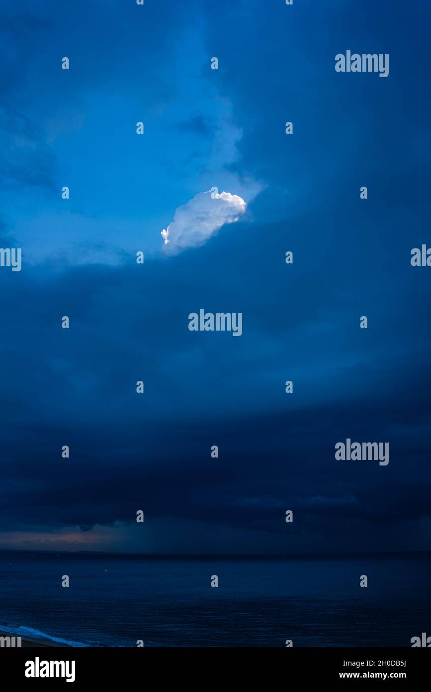 nature background abstract light cloud above dark clouds Stock Photo