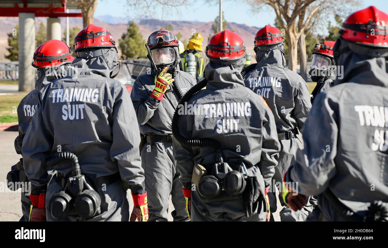A group of Soldiers from the 409th Engineer Company, Task Force 76, 76th Operational Response Command prepare to conduct search and rescue operations during a Chemical, Biological, Radiological and Nuclear (CBRN) disaster response mass casualty decontamination exercise at the Sam Boyd Stadium in Las Vegas, Nevada, Jan. 30. The exercise involves approximately 200 Army Reserve Soldiers as well as local civilian agencies such as the Las Vegas and Henderson Fire Departments. The Soldiers from Task Force 76 specialize in search and rescue, chemical decontamination and medical treatment operations. Stock Photo