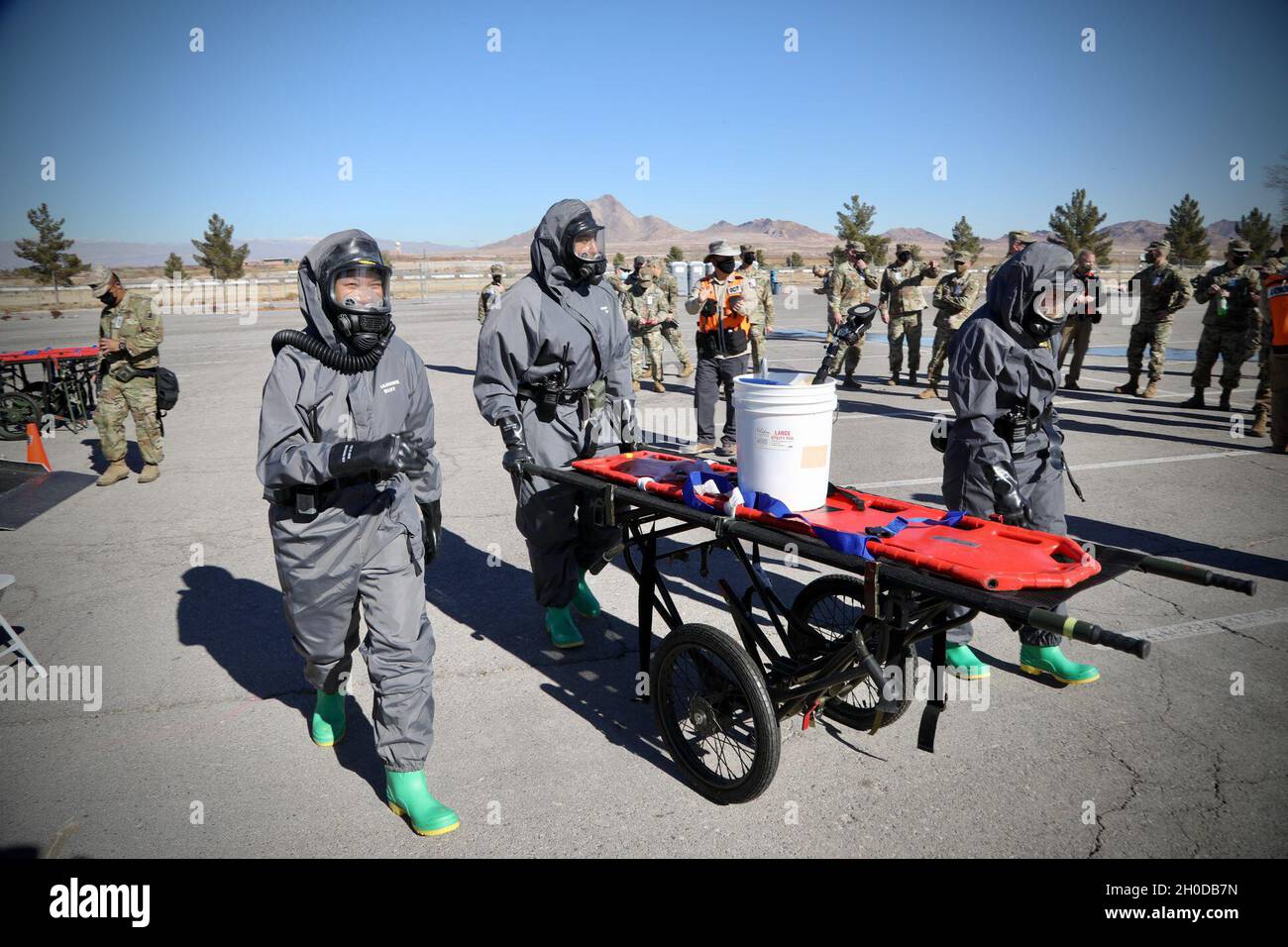 Soldiers from the 409th Engineer Company, Task Force 76, 76th Operational Response Command move supplies on a stretcher during a Chemical, Biological, Radiological and Nuclear (CBRN) disaster response mass casualty decontamination exercise at the Sam Boyd Stadium in Las Vegas, Nevada, Jan. 30. The exercise involves approximately 200 Army Reserve Soldiers as well as local civilian agencies such as the Las Vegas and Henderson Fire Departments. The Soldiers from Task Force 76 specialize in search and rescue, chemical decontamination and medical treatment operations. Stock Photo