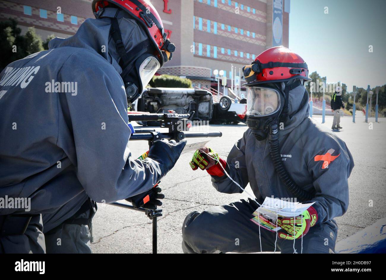 Soldiers from the 409th Engineer Company, Task Force 76, 76th Operational Response Command, check their gear prior to a search and rescue mission during a Chemical, Biological, Radiological and Nuclear (CBRN) disaster response mass casualty decontamination exercise at the Sam Boyd Stadium in Las Vegas, Nevada, Jan. 30. The exercise involves approximately 200 Army Reserve Soldiers as well as local civilian agencies such as the Las Vegas and Henderson Fire Departments. The Soldiers from Task Force 76 specialize in search and rescue, chemical decontamination and medical treatment operations. Stock Photo
