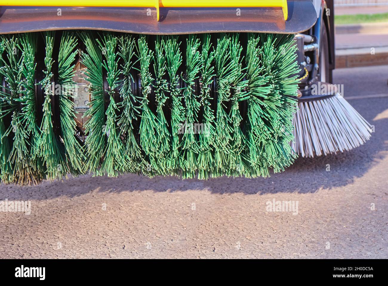 Rotating new brush of street sweeper cleaning machine.Big round broom