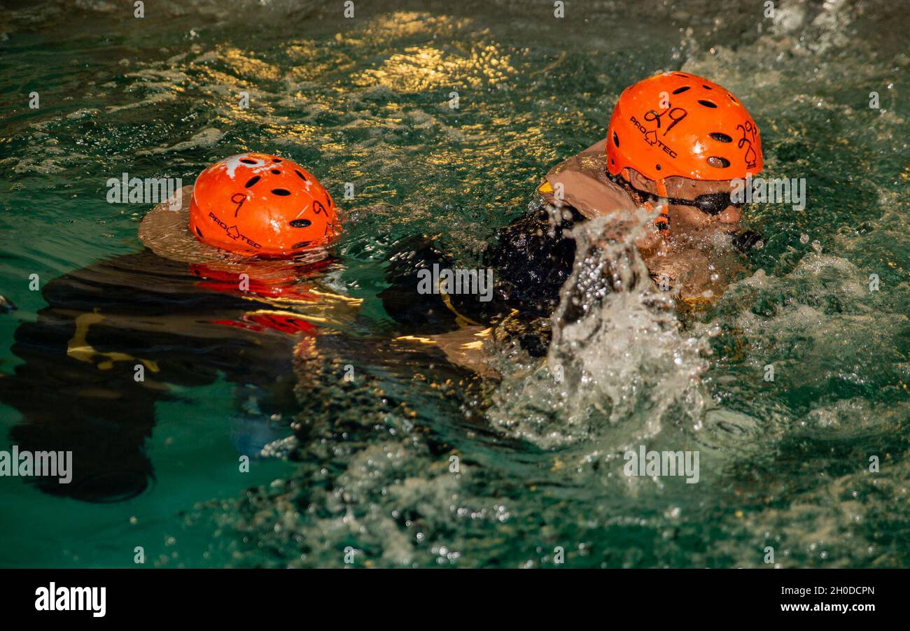 Egress Training U.S. Marines come up to take a breath after escaping the Modular Egress ...