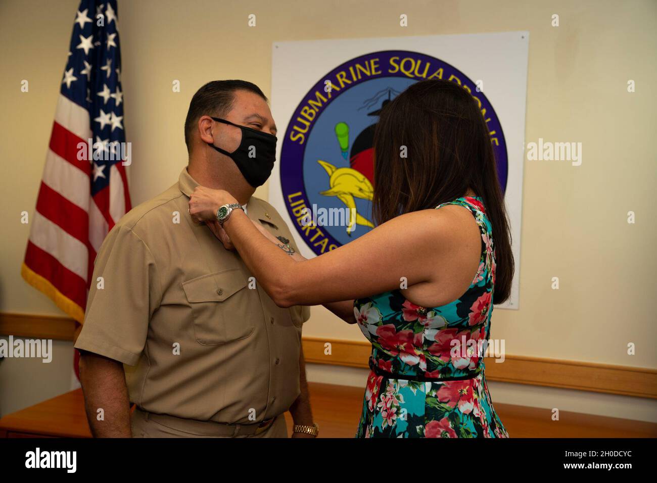 NAVAL BASE GUAM, Guam (Feb. 2, 2021) - Chief Warrant Officer Andrew De La O, from San Antonio, Texas, is pinned by his wife, Valerie, during a promotion ceremony held at Konetzni Hall. Commander, Submarine Squadron 15 is responsible for providing training, material, and personnel readiness support to multiple Los Angeles-class fast-attack submarine commands located at Polaris Point, Naval Base Guam. Stock Photo