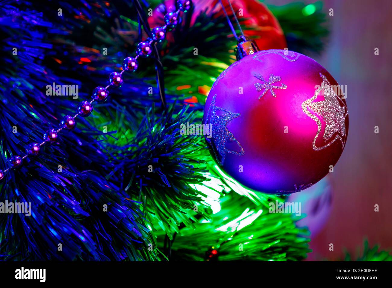Christmas ball decoration of the Christmas tree with purple and blue tones Stock Photo