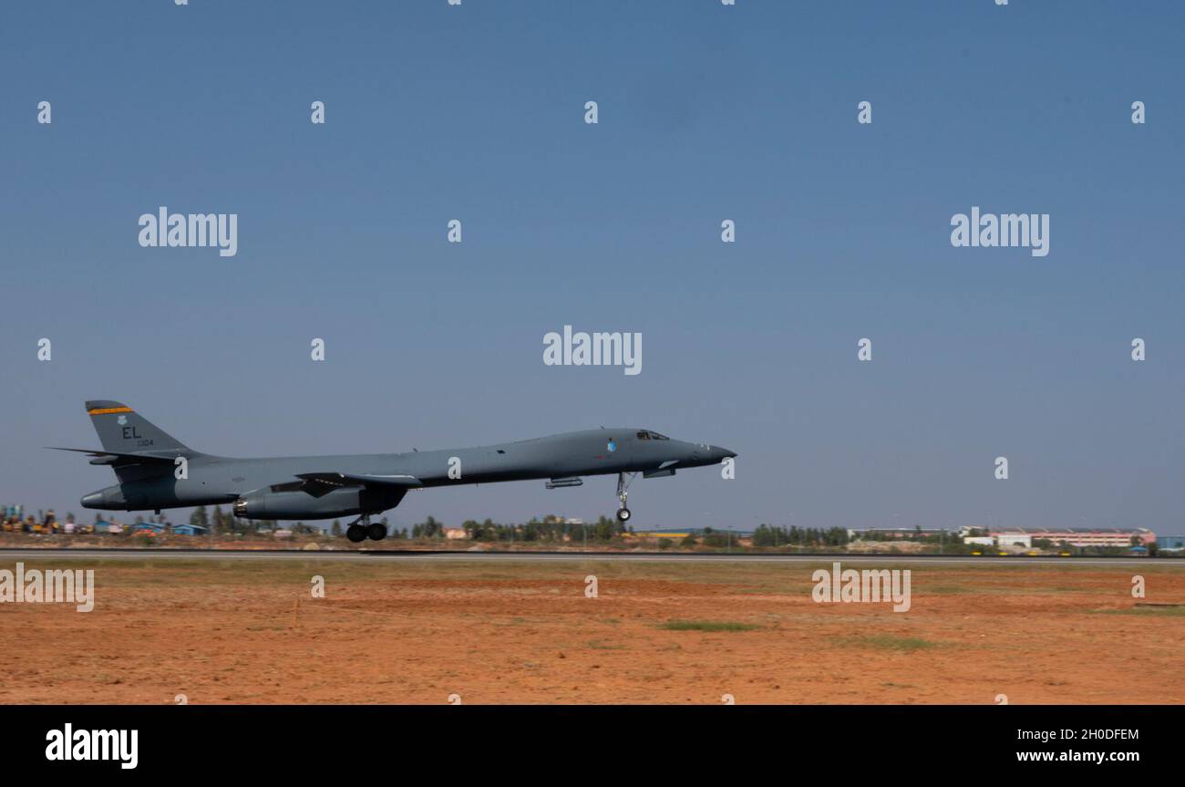 A B-1B Lancer assigned to the 34th Expeditionary Bomb Squadron, Ellsworth Air Force Base, S.D., lands at Kempegowda International Airport in Bengaluru, India, following a 26-hour sortie, Feb. 1, 2021. The B-1 is set to perform a flyover alongside Indian Air Force planes during the Aero India 2021 tradeshow. The B-1 is a multi-role, long-range bomber capable of carrying the largest conventional payload of both guided and unguided weapons in the U.S. Air Force inventory. Stock Photo