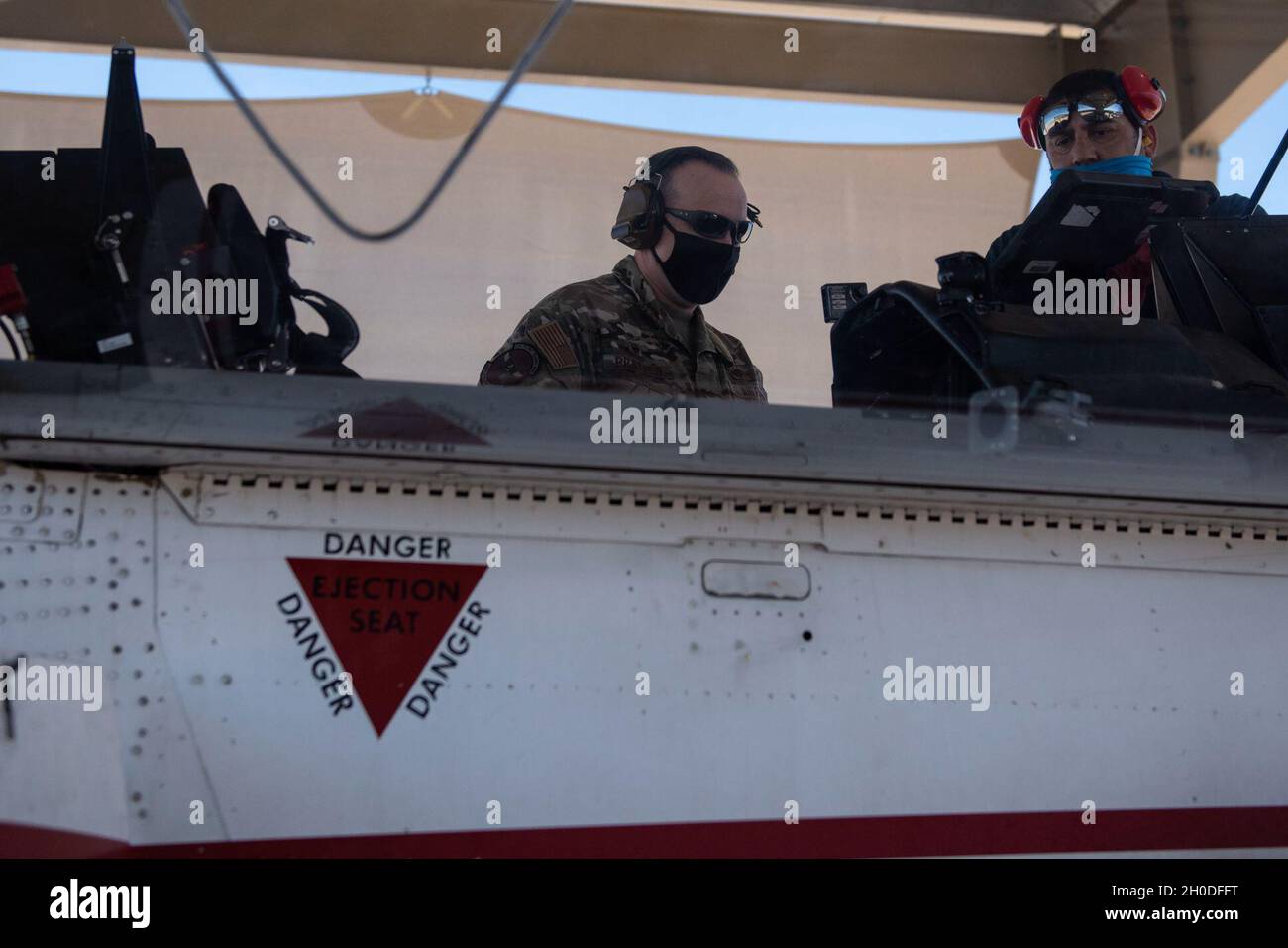 Col. Craig Prather, 47th Flying Training Wing commander, joins chief of maintenance George Hernandez on the flight line to look over the T-6A Texan II on Feb. 01, 2021, Laughlin Air Force Base, Texas. This visit was part of Col. Prather’s immersion with the maintenance teams on the flight line. Stock Photo