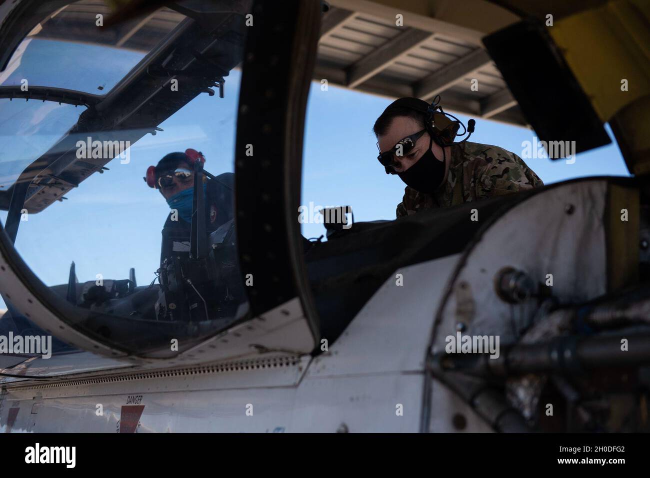Col. Craig Prather, 47th Flying Training Wing commander, joins chief of maintenance George Hernandez on the flight line to look over the T-6A Texan II on Feb. 01, 2021, Laughlin Air Force Base, Texas. This visit was part of Col. Prather’s immersion with the maintenance teams on the flight line. Stock Photo