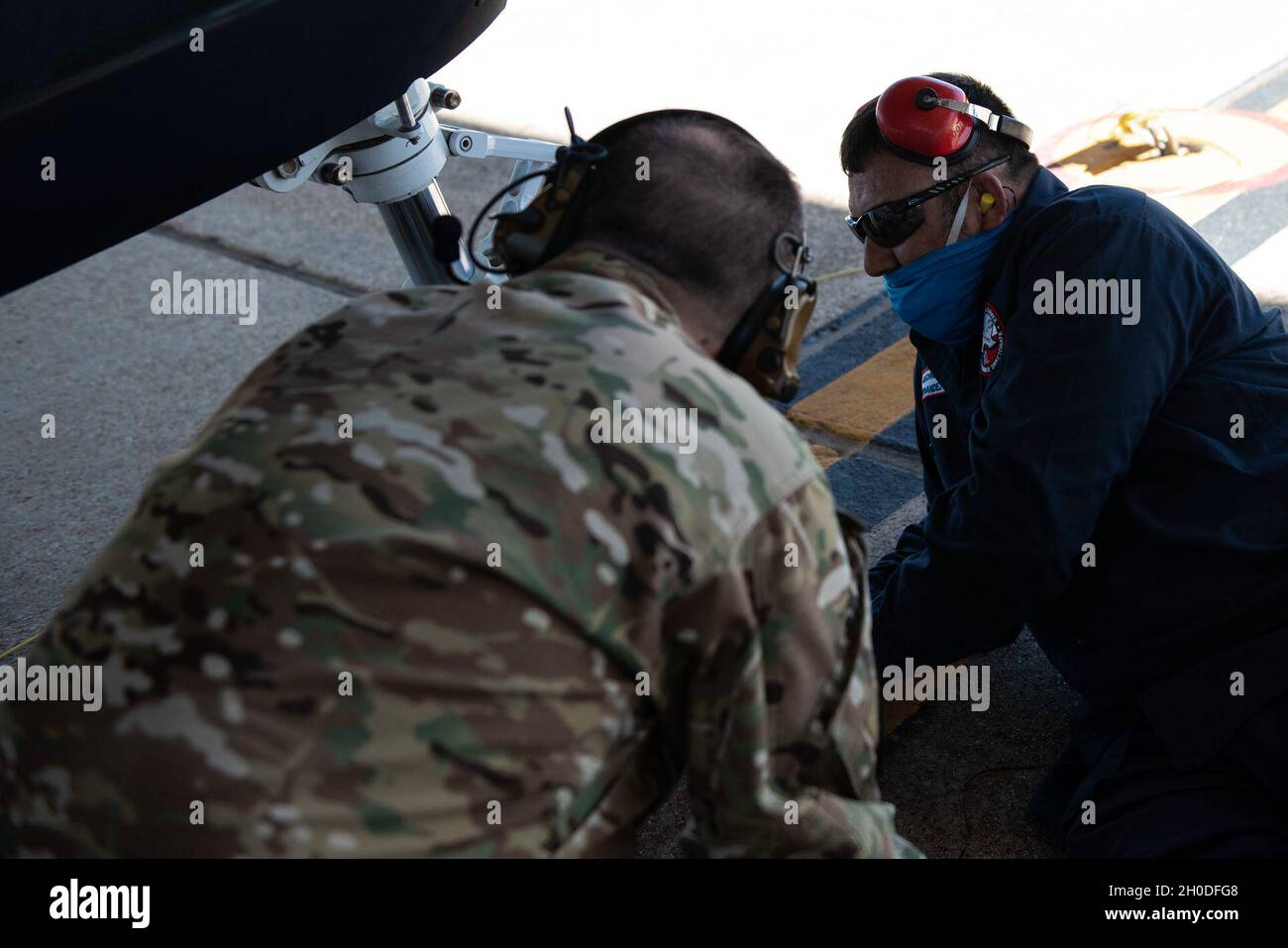 Col. Craig Prather, 47th Flying Training Wing commander, joins chief of maintenance George Hernandez on the flight line to look over the T-6A Texan II on Feb. 01, 2021, Laughlin Air Force Base, Texas. This visit was part of Col. Prather’s immersion with the maintenance teams on the flight line. Stock Photo