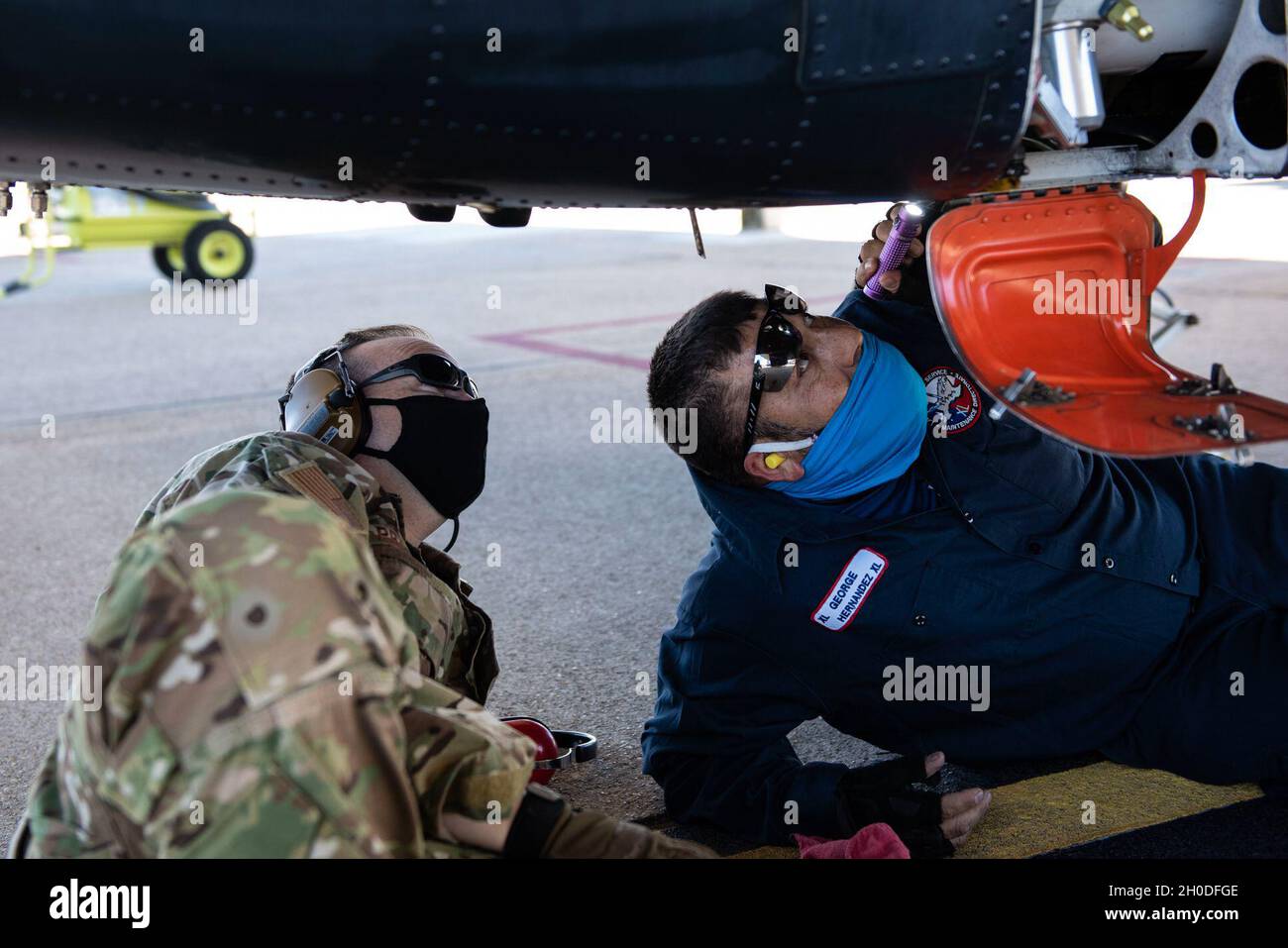 Col. Craig Prather, 47th Flying Training Wing commander, joins chief of maintenance George Hernandez on the flight line to look over the T-6A Texan II on Feb. 01, 2021, Laughlin Air Force Base, Texas. This visit was part of Col. Prather’s immersion with the maintenance teams on the flight line. Stock Photo