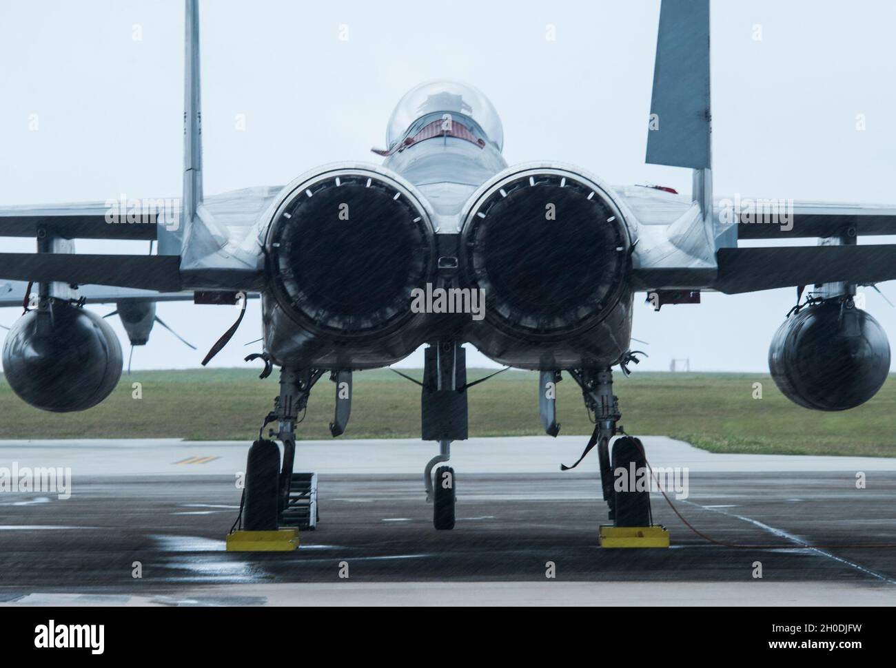 A Koku-Jieitai F-15J Eagle sits on the flightline during Cope North 21 at Andersen Air Force Base, Guam, Feb. 3, 2021. The mission of the exercise is to focus on coordination of combined air tactics, techniques and procedures, and enhancing security and stability in the Indo-Pacific region. Stock Photo