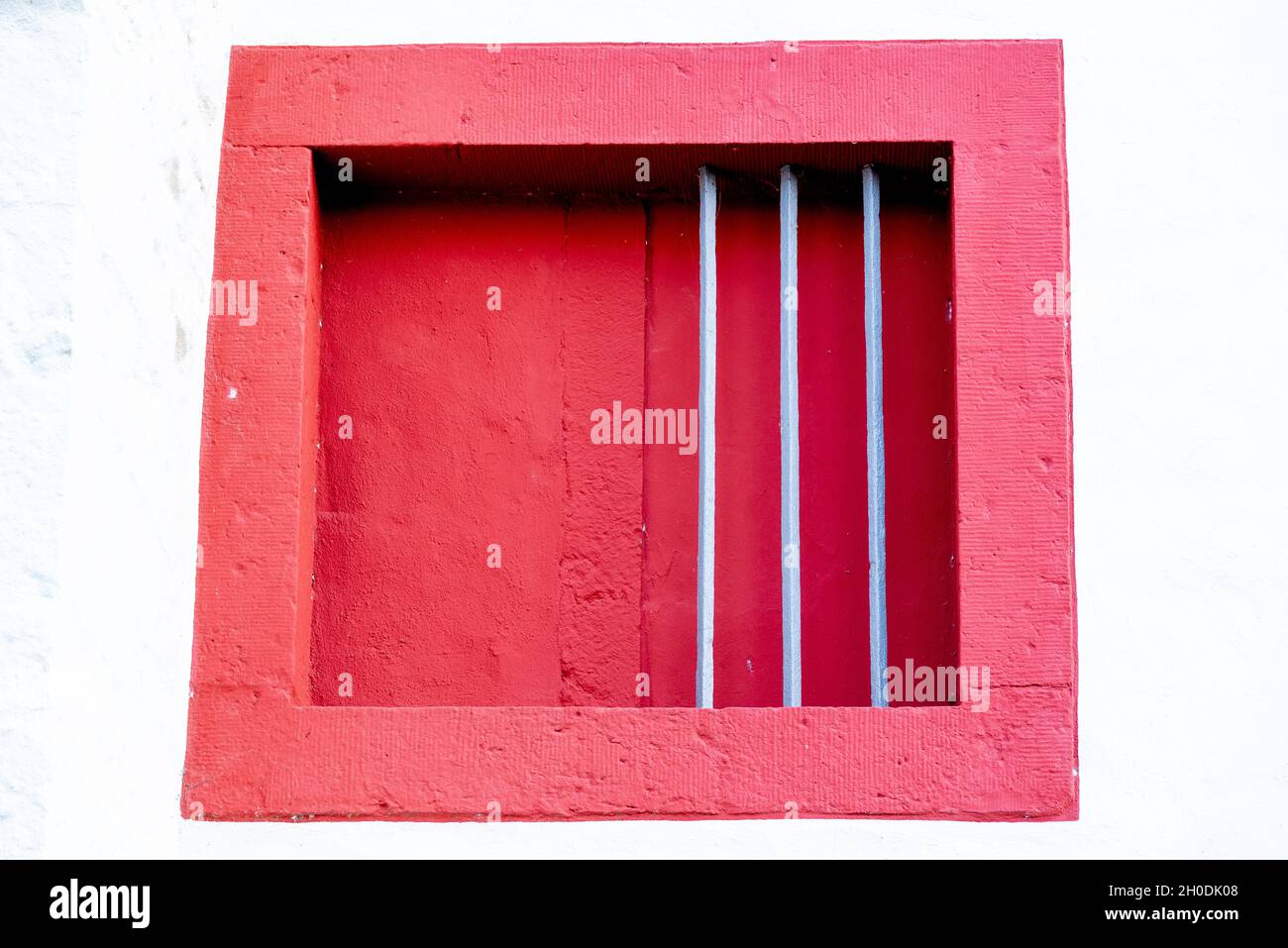 Red framed window closed with metal wires Stock Photo - Alamy